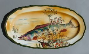 A Doulton dish signed Slater Del with a fish painted on