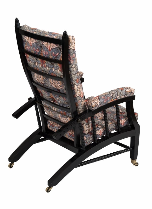 A Morris & Co. ebonised reclining chair Paul Reeves